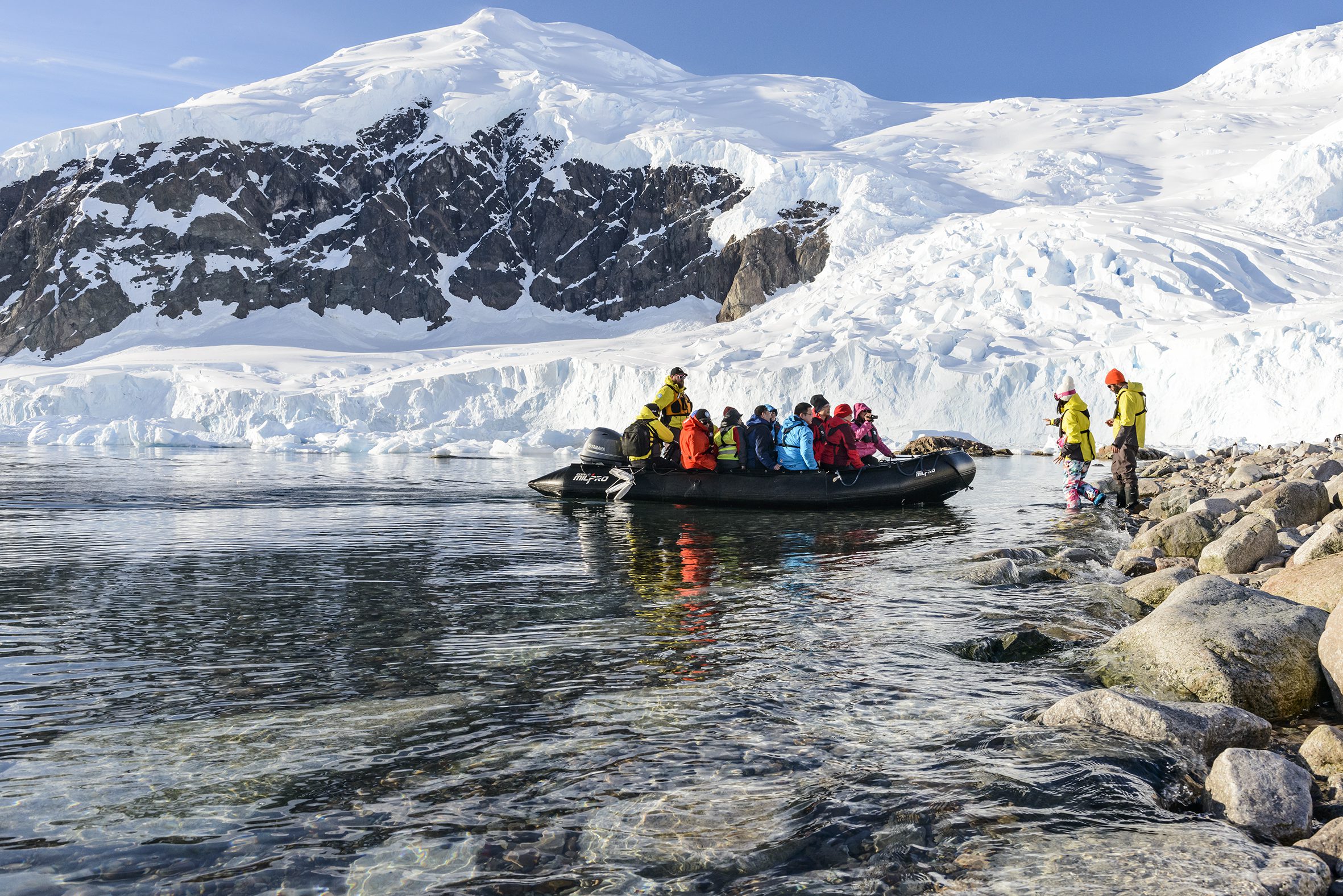 Zodiac approaching the landing site at Neko Harbour with the glacier in the background